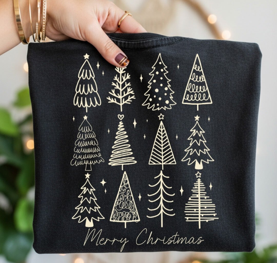 Black tee with white line-drawn Christmas trees and Merry Christmas text